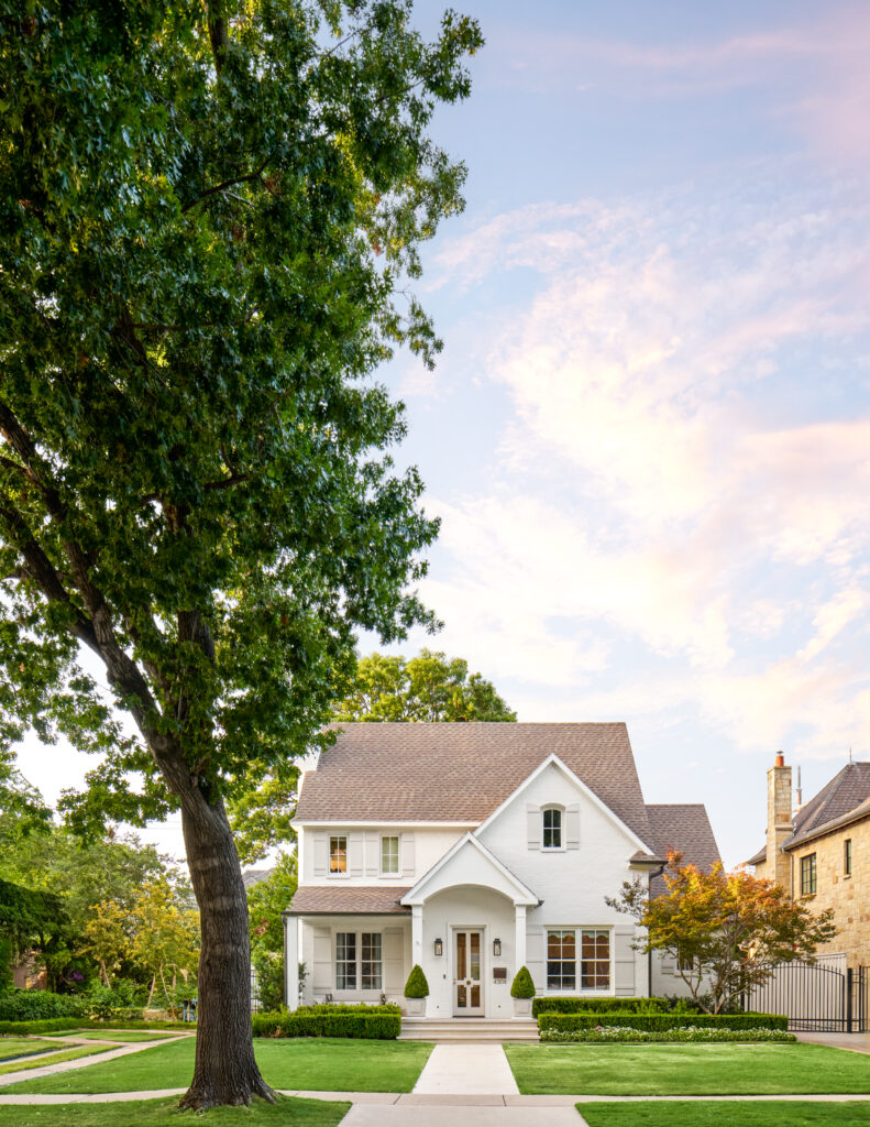 Custom home with farmhouse white finishes and custom luxury exterior accents