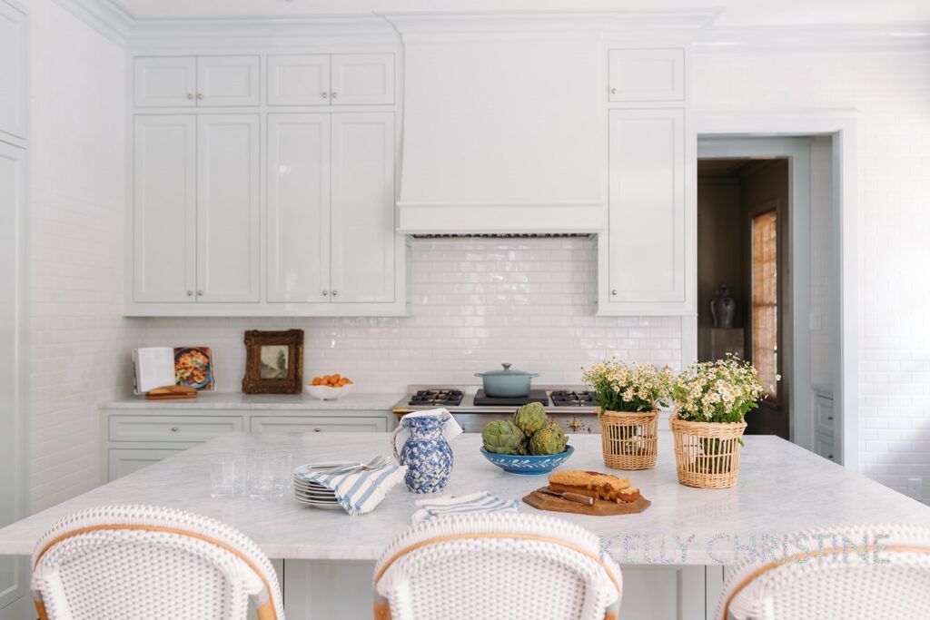 Recent project of a luxury custom home with a client chosen hand crafted moulding, light blue painted trim over a beautiful range built and renovated kitchen by Gillis Custom Homes in Dallas Texas